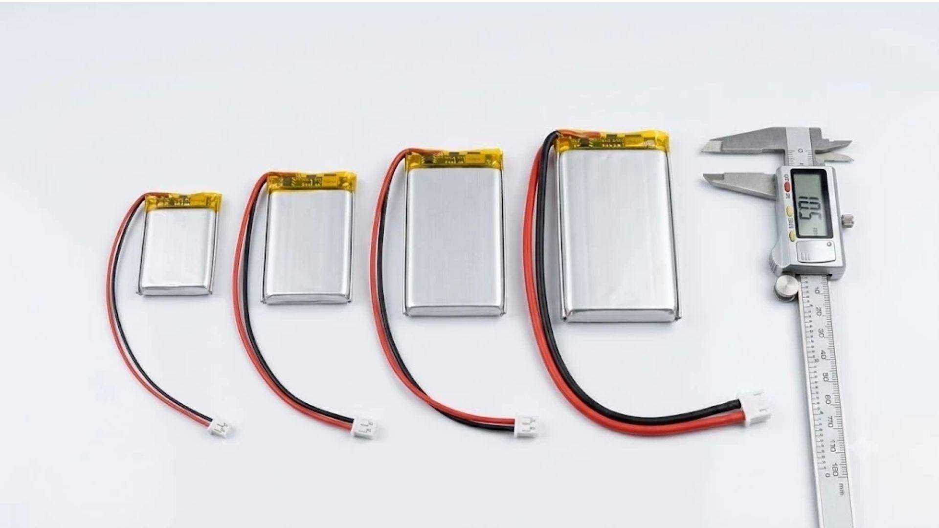 Lithium polymer battery packs with red and black lead wires and JST connectors in different wire gauges on a white background